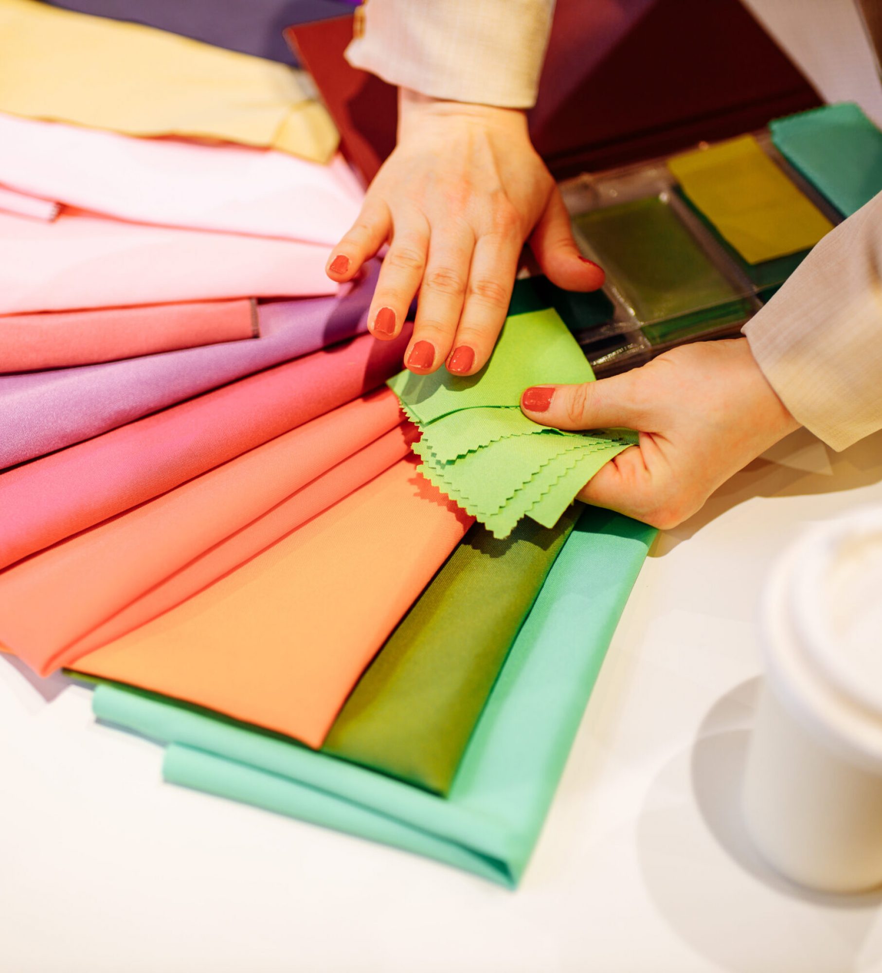 the stylist conducts a color type procedure for a woman,personal consultation about color in clothing the stylist conducts a color type procedure for a woman,personal consultation about color in clothing .